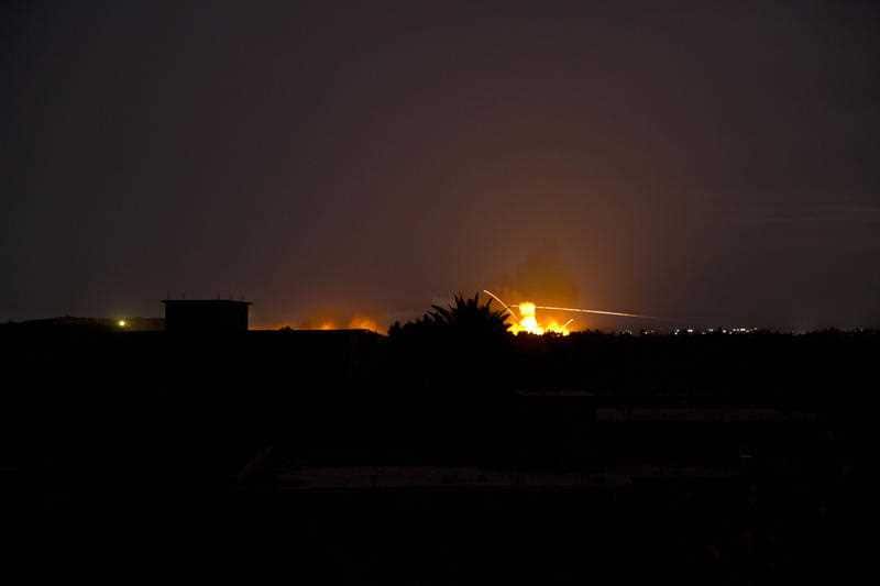 Tracer fire and explosions lights up the night sky as US-backed Syrian Democratic Forces (SDF) fire on Baghou.