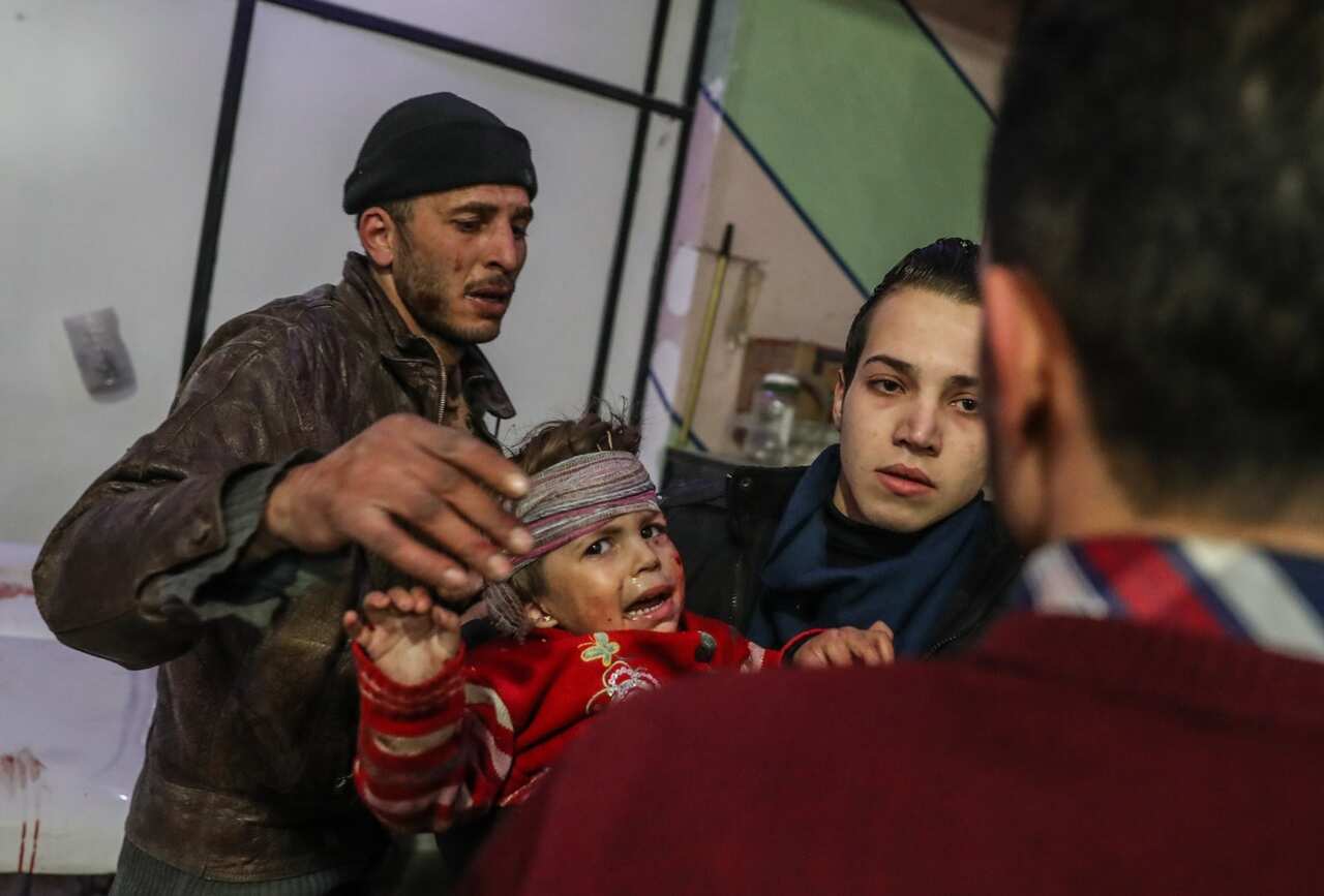 Injured children are treated at a hospital in rebel-held Douma, Eastern Ghouta, Syria, 19 February 2018. 