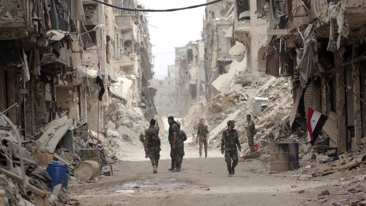 Syrian soldiers patrol at the Yarmouk Camp district in south Damascus, Syria, 22 May 2018.