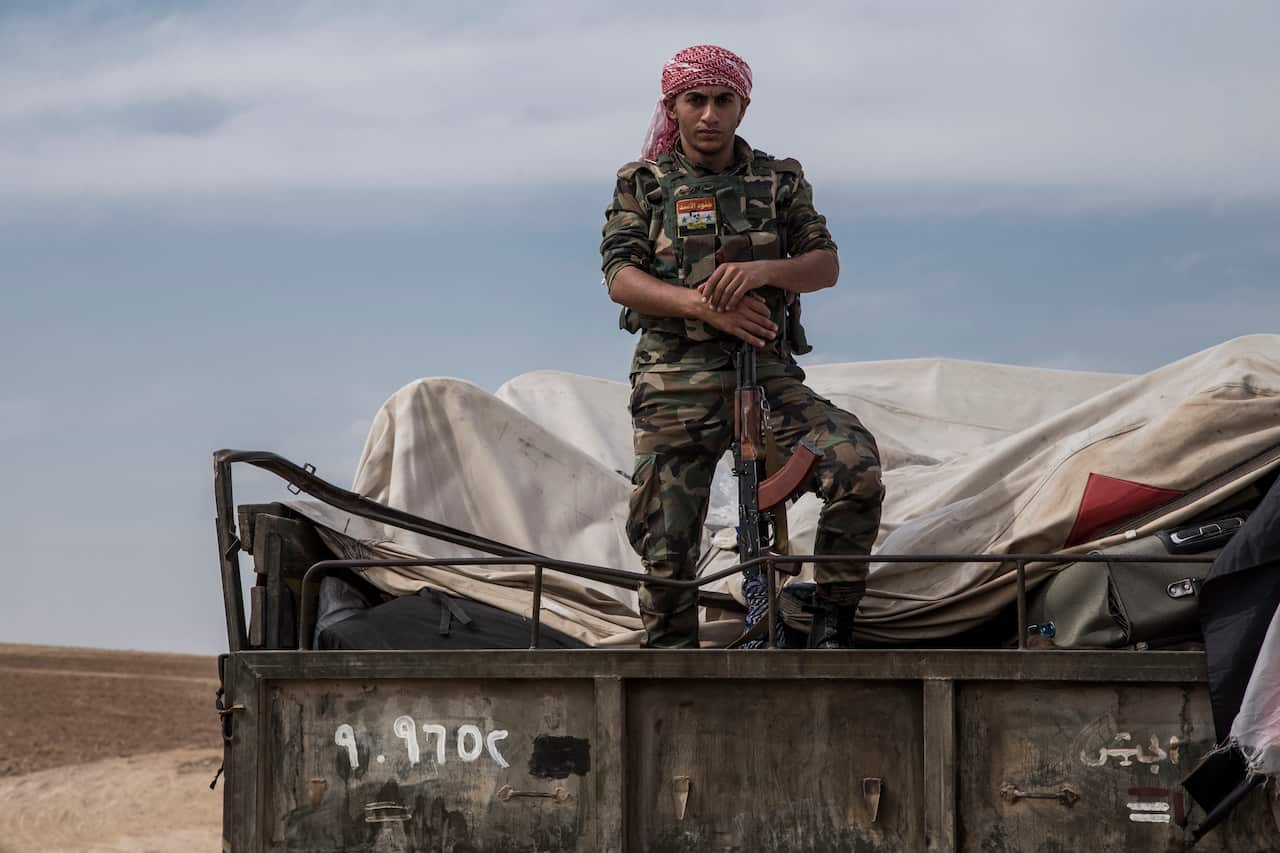 Syrian government forces deploy near the town of Tal Tamr in northern Syria.