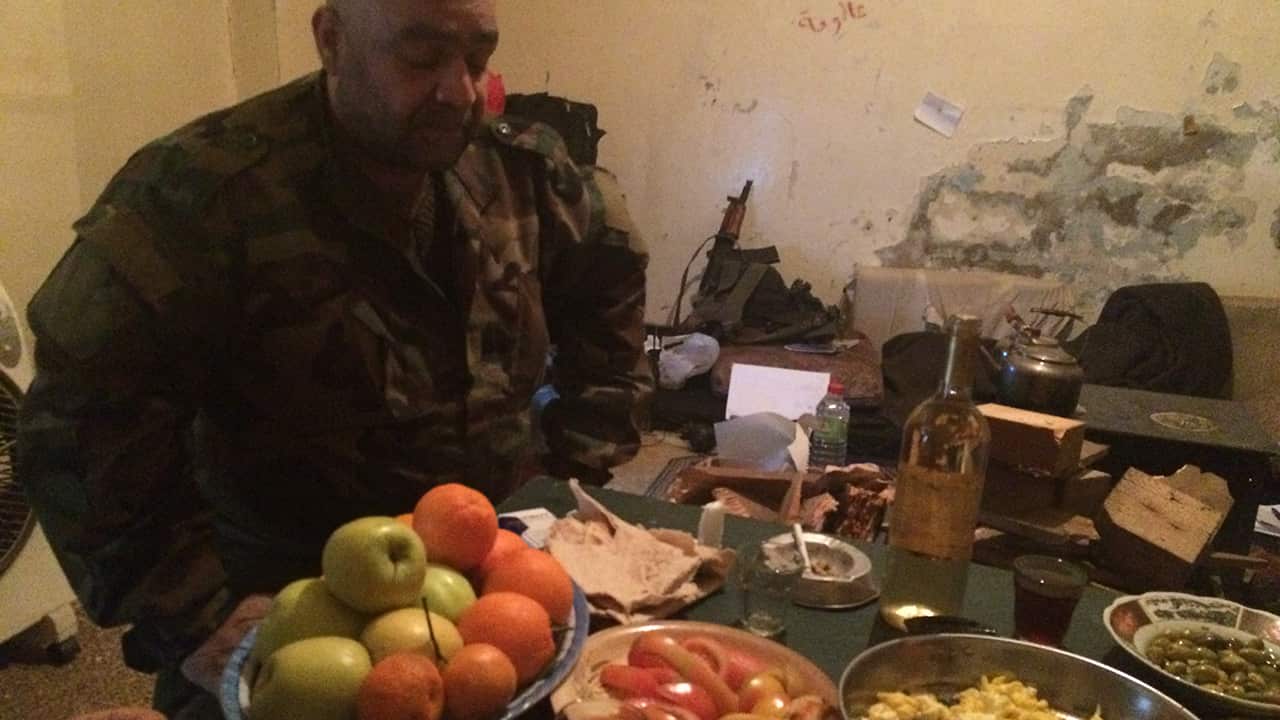 Colonel Zarqa with the surprising feast in his Syrian bunker.