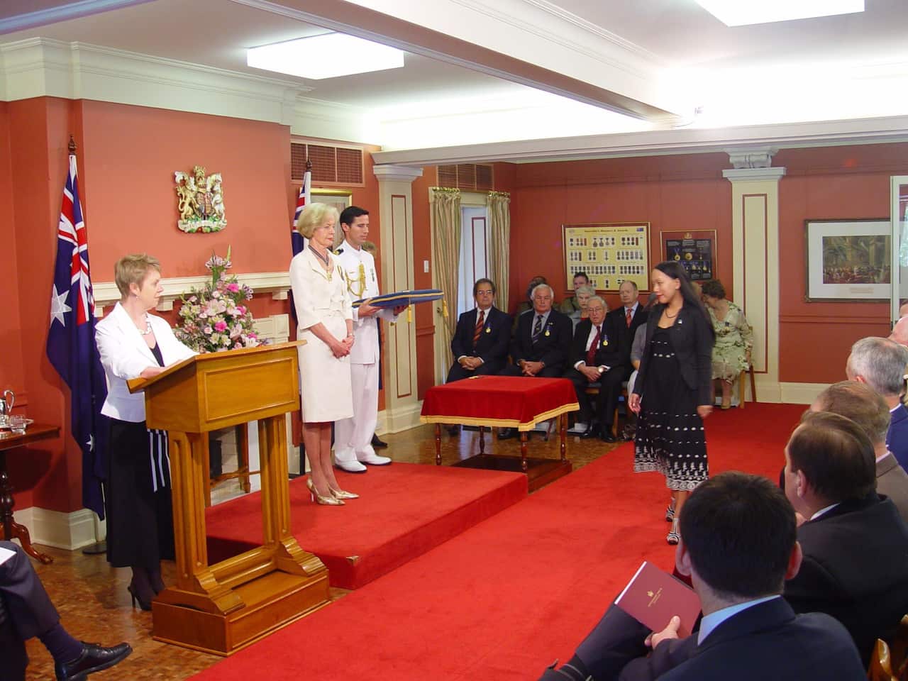 Indigo receiving her OAM from then-Queensland Governor Dame Quentin Bryce