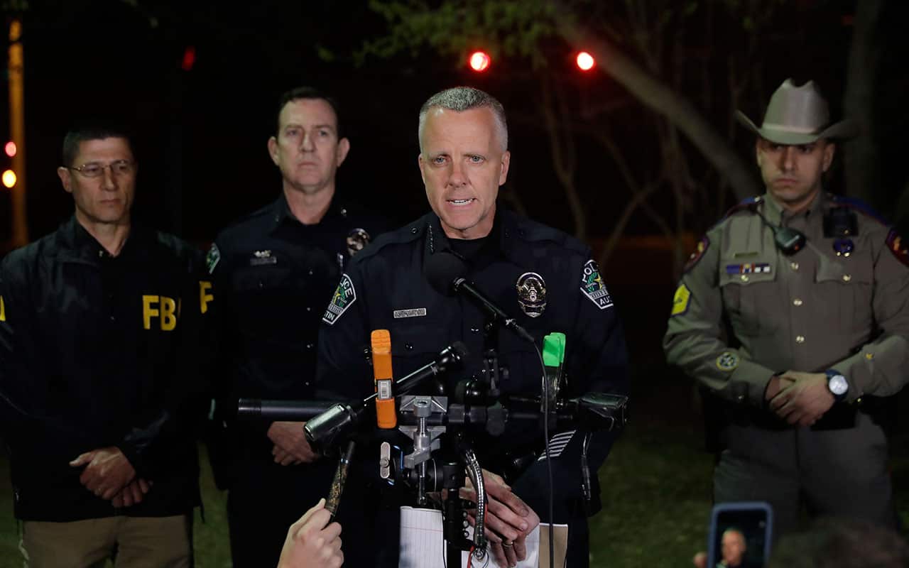 Interim Austin police Chief Brian Manley, center, talks to the media after another explosion, early Monday, March 19, 2018, in Austin, Texas.
