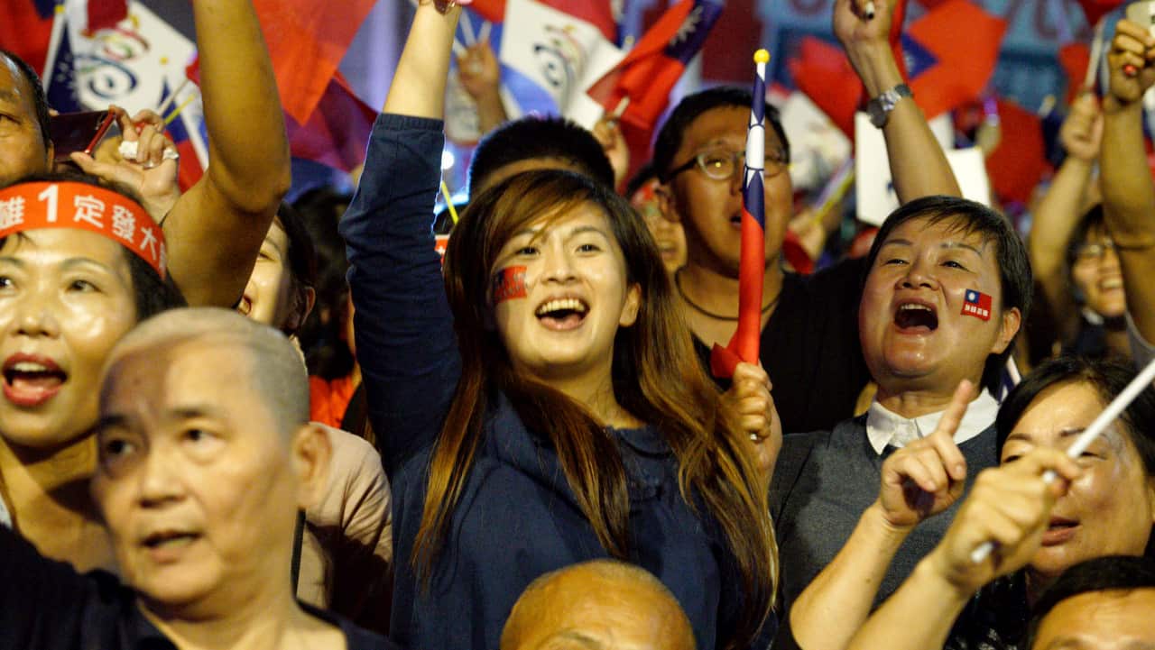 Supporters of the opposition Nationalist Party celebrate in Kaohsiung, Taiwan.