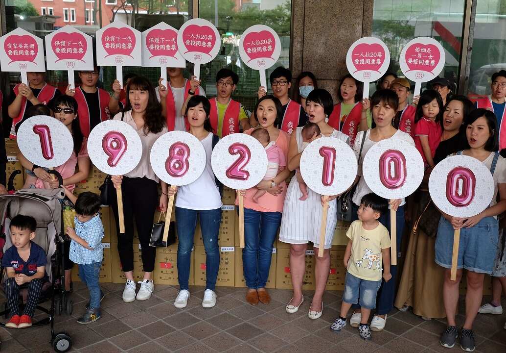 Anti-gay marriage protesters display the number of anti-gay marriage petition signatures outside Taiwan's Central Election Commission.