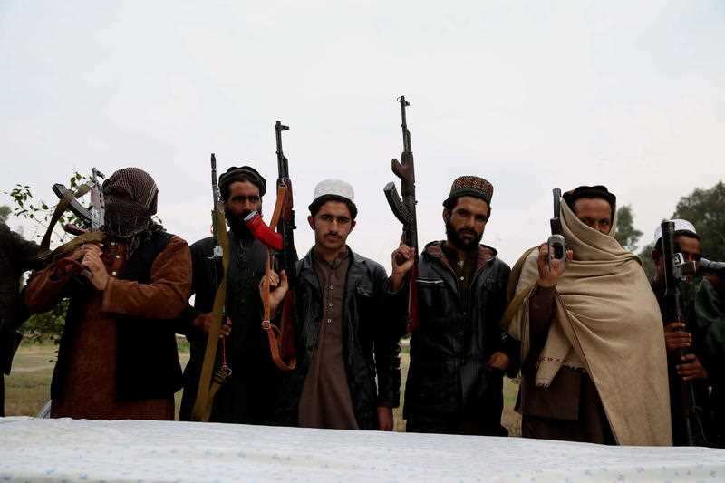 Former Taliban and IS militants surrender their weapons during a reconciliation ceremony in Jalalabad, Afghanistan last month.