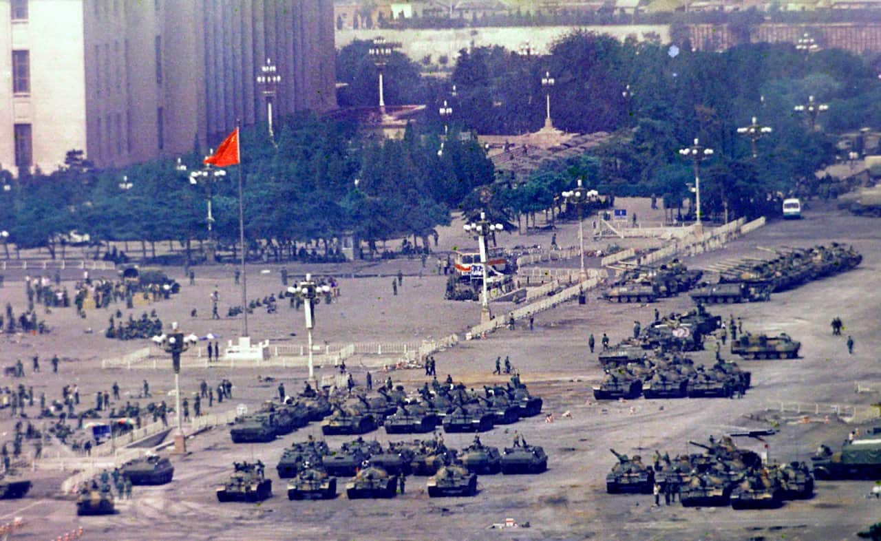Chinese troops and tanks gather in Beijing on 5 June 1989, one day after the military crackdown that ended a seven week pro-democracy demonstration.