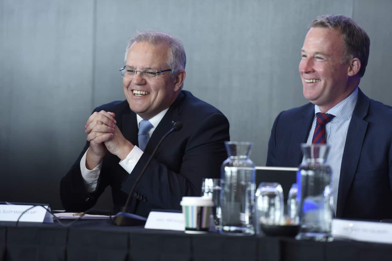 Prime Minister Scott Morrison (left) sits next to then-Premier Will Hodgman at the TAS State Liberal Party Conference last year.