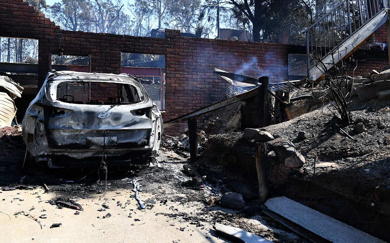 Some of the more than 70 houses and businesses destroyed by a bushfire in the coastal town of Tathra, Monday, March 19, 2018. 