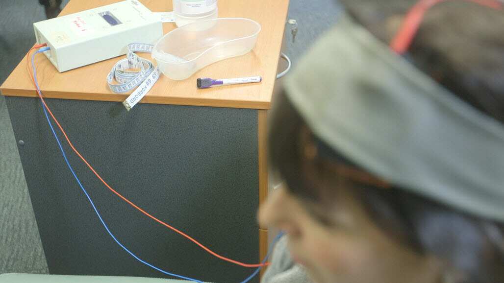 A volunteer is connected to a transcranial direct stimulation (tDCS) machine at the Black Dog Institute. (SBS)