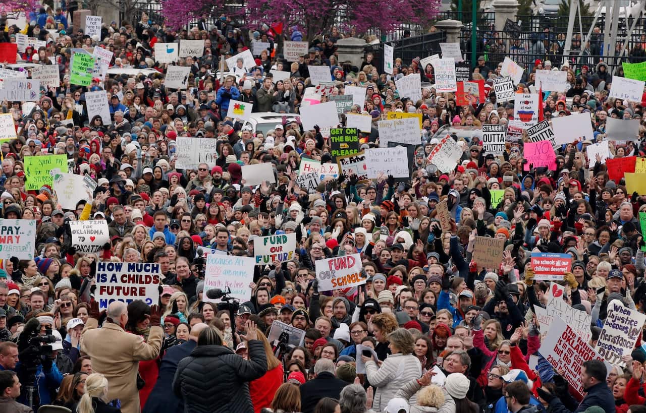 The crowd cheers during a teacher rally at the state Capitol in Oklahoma City, Monday, April 2, 2018. 