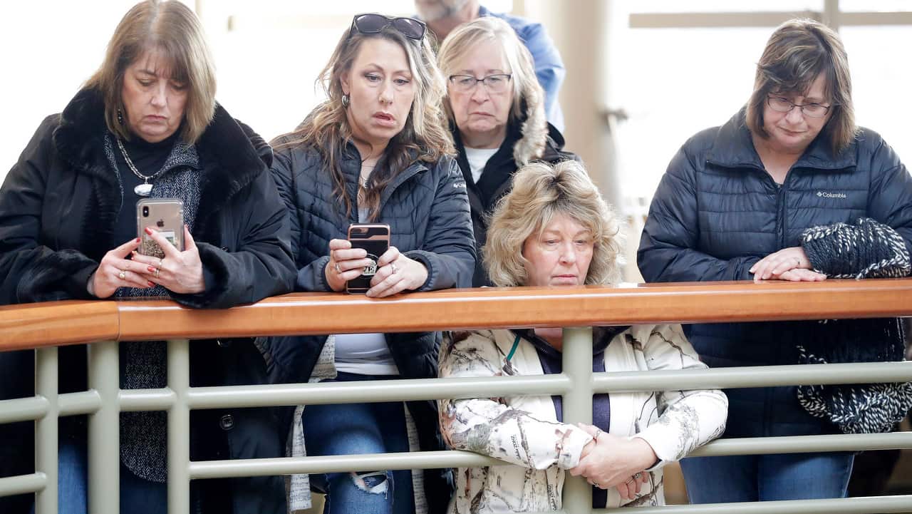 Community members listen as Barron County Sheriff Chris Fitzgerald speaks during a press conference at the Barron County Sheriffs Department.