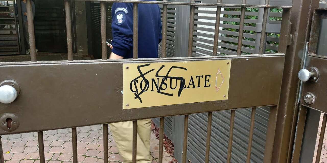 A handout photo released by the Israeli police spokesman shows anti-Polish graffiti written at the entrance to the Polish embassy in Tel Aviv.