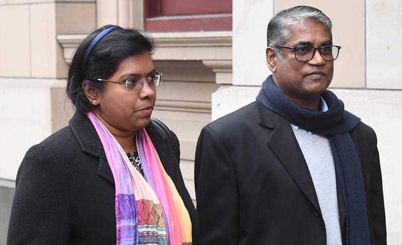 Roger Singaravelu (left) and Maha Solomon leave the Supreme Court of Victoria in Melbourne, following the decision. 