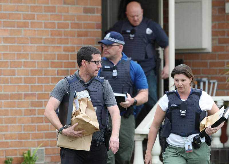 Police take items from the Coolaroo home.