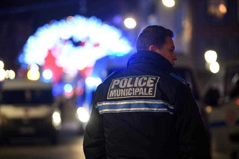 A French police officer stands near the shooting site at the Christmas Market in Strasbourg.