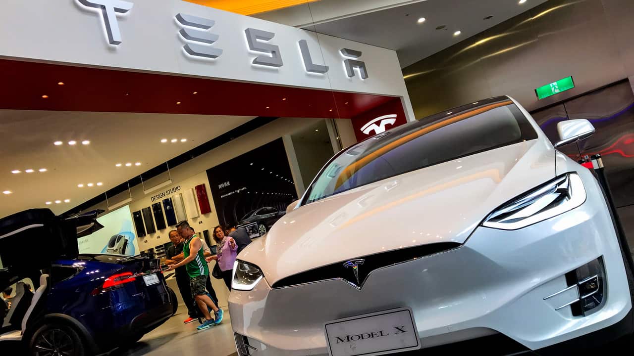 People view Tesla cars at a Tesla showroom center in Taipei, Taiwan on 27 August 2018.  