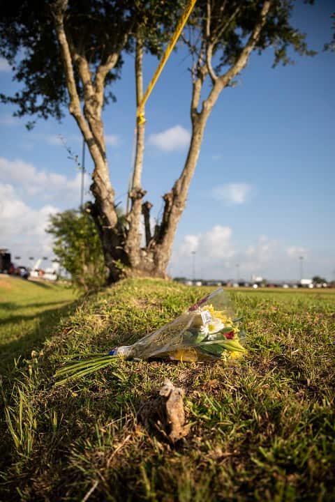 Flowers left outside the Santa Fe High School a day after a mass shooting there left 10 dead, in Santa Fe, Texas.
