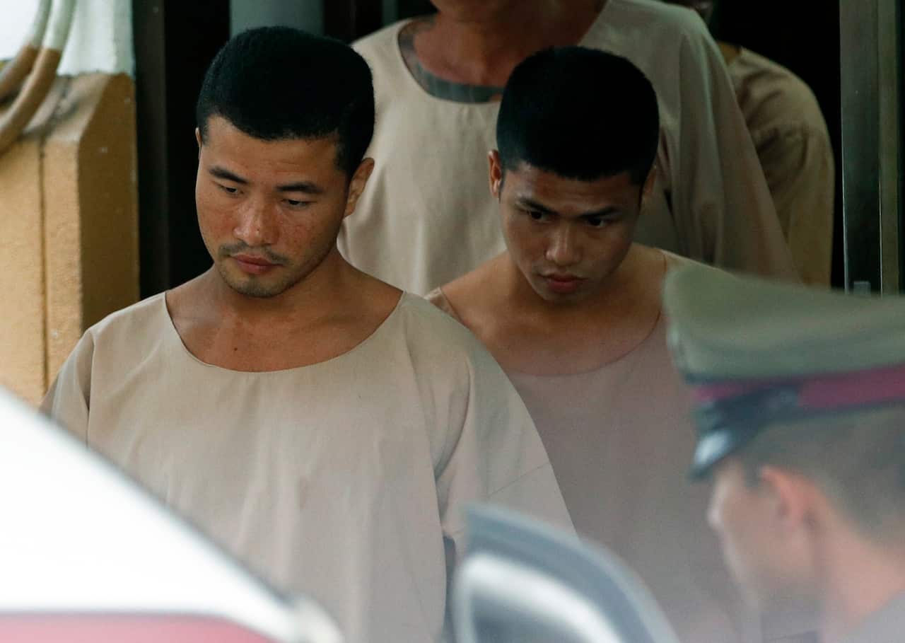 Zaw Lin (L) and Wai Phyo (R) are escorted by Thai police officers after they were sentenced to death in 2014.