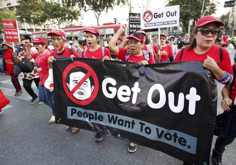 Pro-democracy demonstrators shout slogans during a rally to protest the possible delay of the general election in Bangkok.