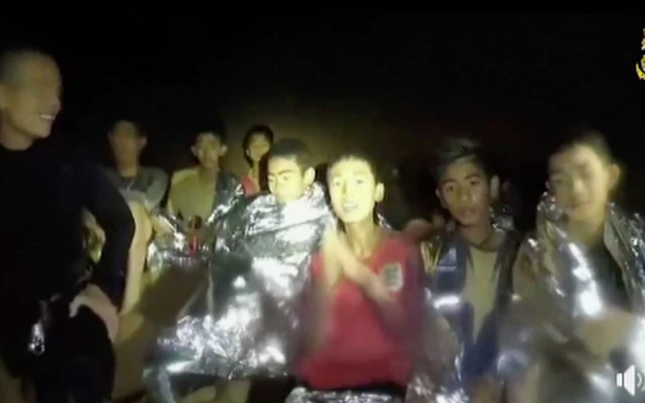 The Thai boys were pictured with Navy Seals inside the cave in northern Thailand. 