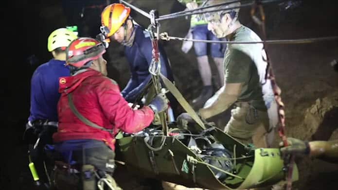 Footage of divers pulling the last boys to safety from the flooded cave.