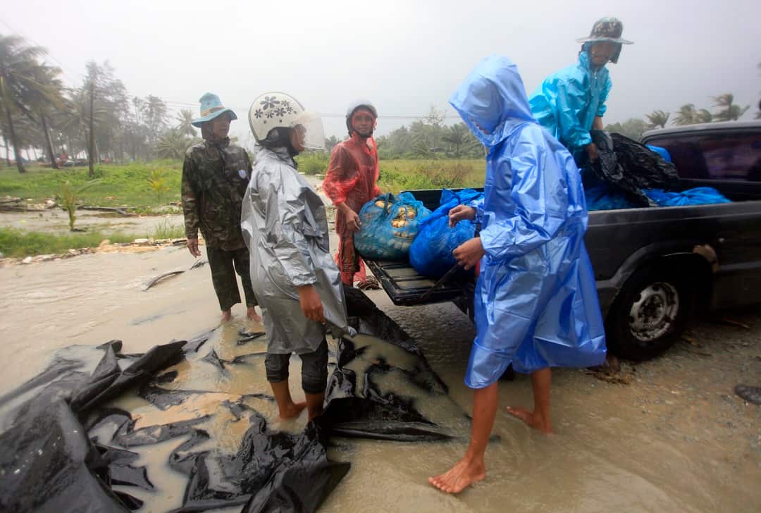 Rain, winds and surging seawater are striking southern Thailand as a strengthening tropical storm nears coastal villages and popular tourist resorts.
