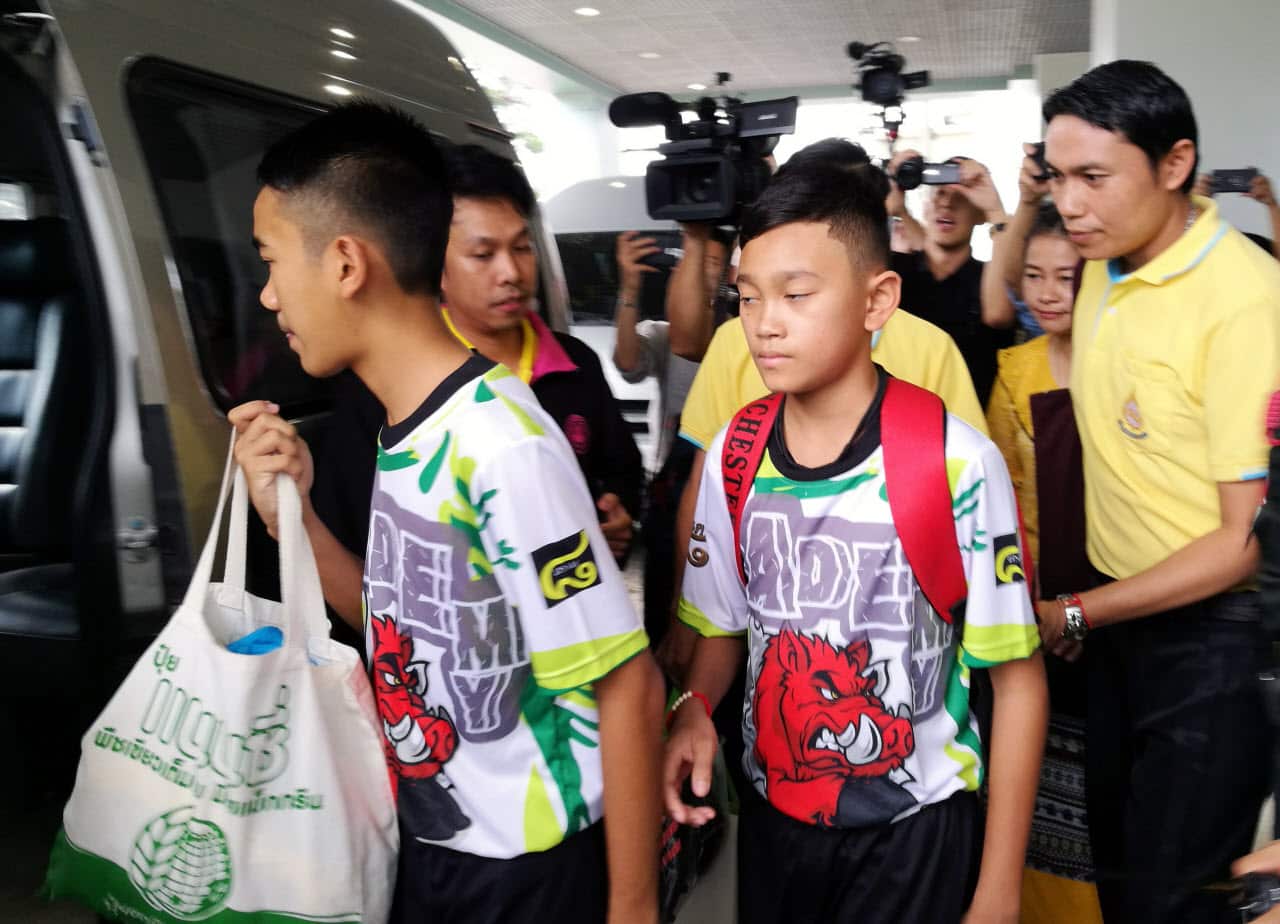 Some of the rescued twelve members of the Wild Boar football team depart from the Chiangrai Prachanukroh Hospital in Chiang Rai province, Thailand.
