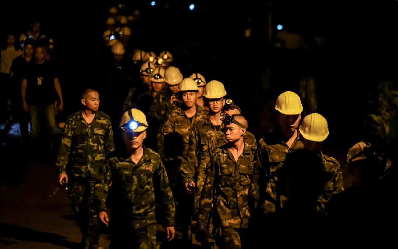 Hundreds of rescuers with equipment continue the rescue operation at the Tham Luang Nang Non cave on July 06, 2018 