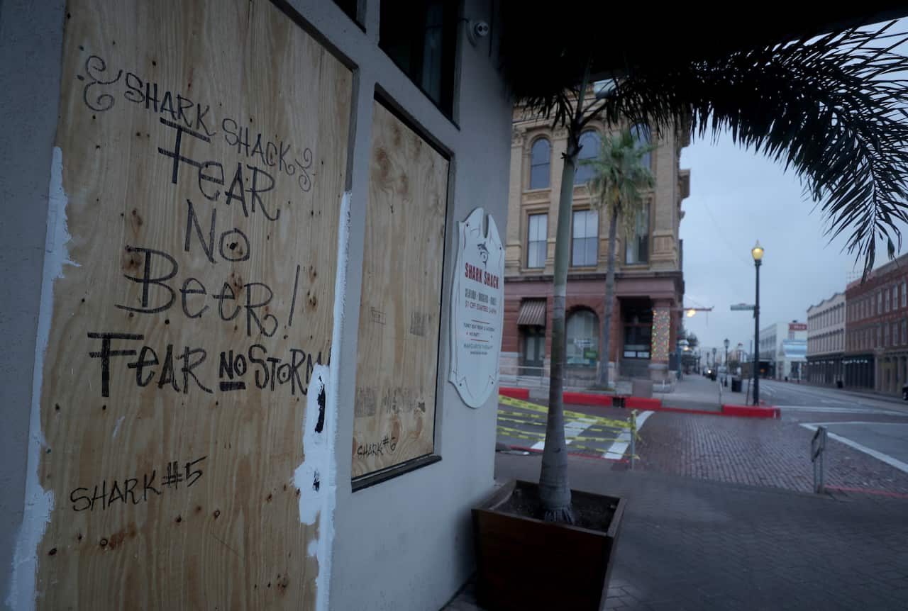 The Shark Shack Beach Bar and Grill is boarded up on the nearly deserted Strand Street in Galveston (AAP)