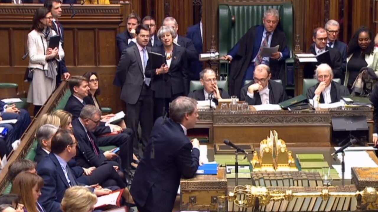 Prime Minister Theresa May (back centre left) before giving a statement about progress on Brexit talks to MPs in the the House of Commons, London. 