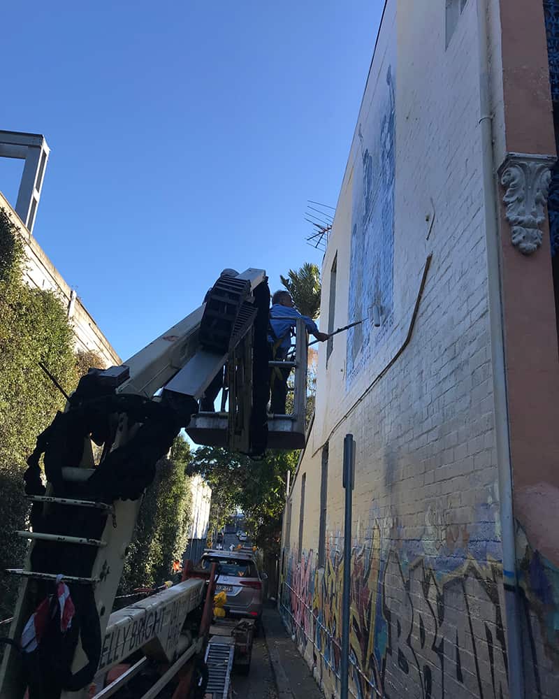 Upgrade works underway on the Three Proud People mural in Newtown, Sydney.