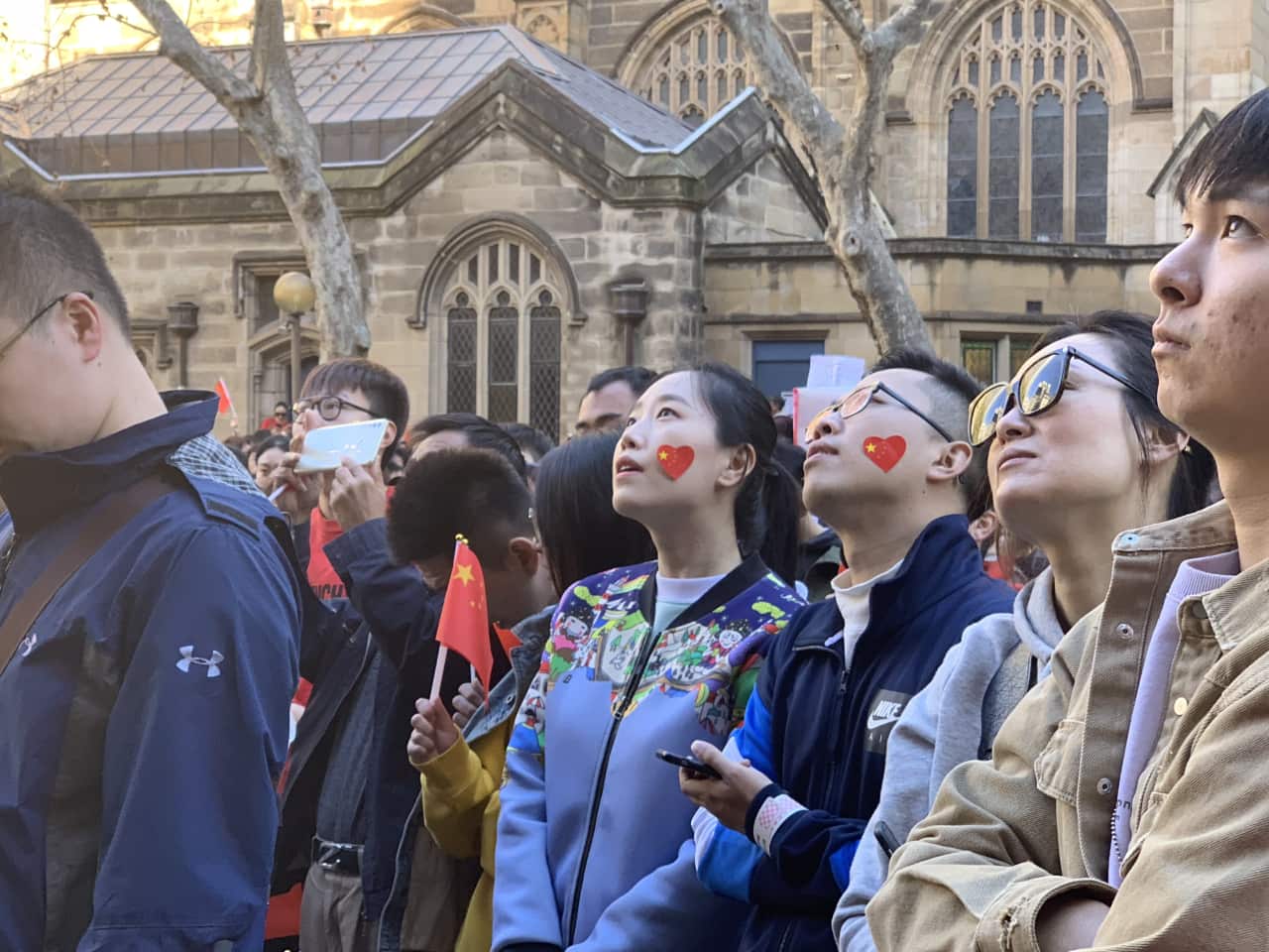 People attend a pro-China march in Sydney