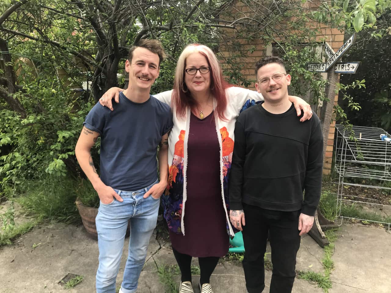 Grant (right), his mother Karen (middle) and younger brother Tyler (left) at his studio.