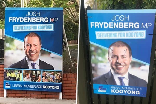 Two of the vandalised posters.