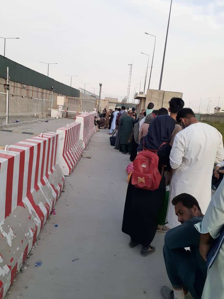 Former interpreters for Australia lined up at the airport gate hoping to get on an evacuation flight on Tuesday night.