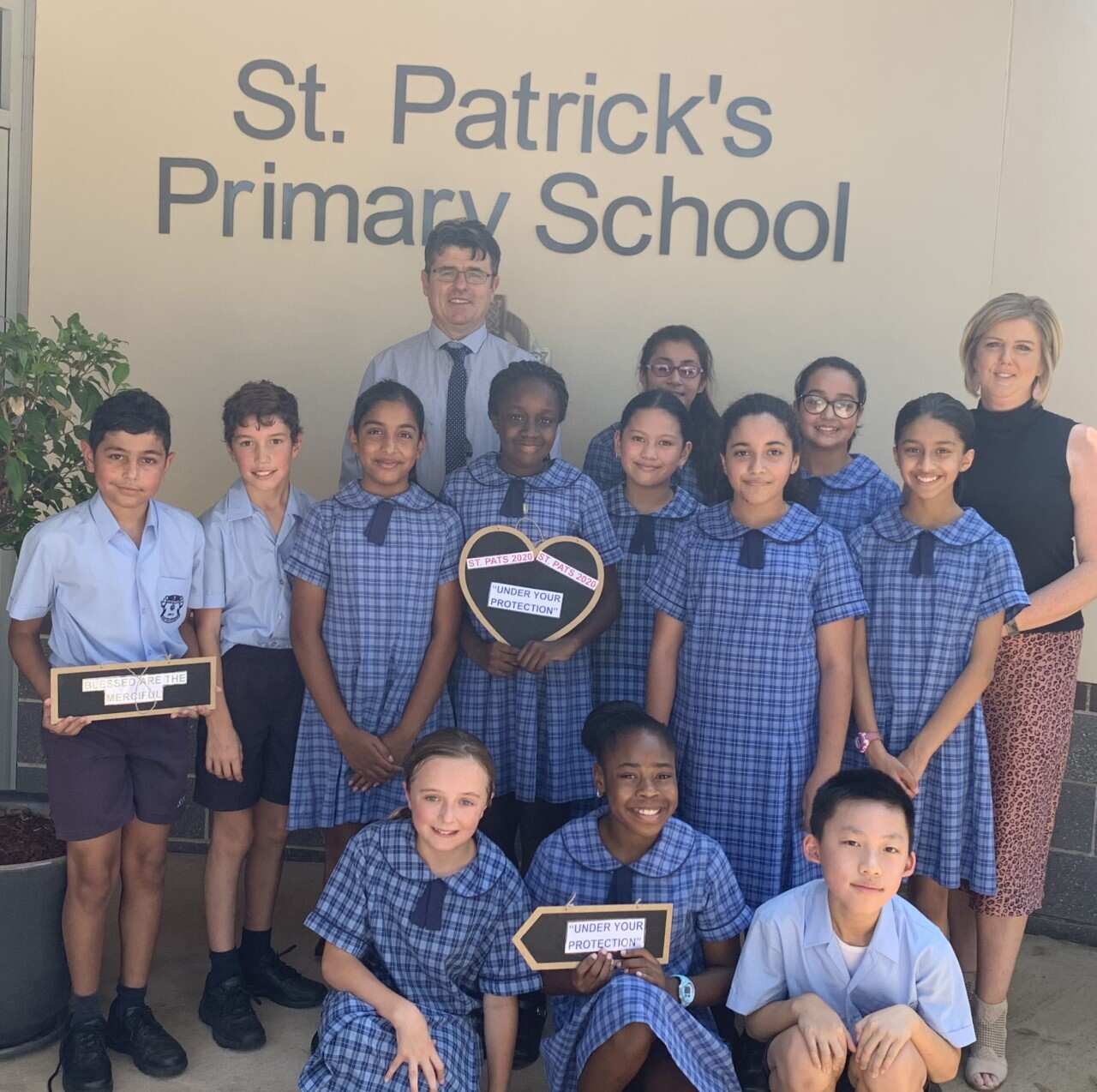 Principal Monica Fitzalan, Assistant Principal Thomas Crowley and students of St Patrick's Primary Blacktown.