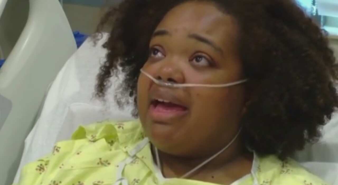 Survivor Tia Coleman speaks to the media.