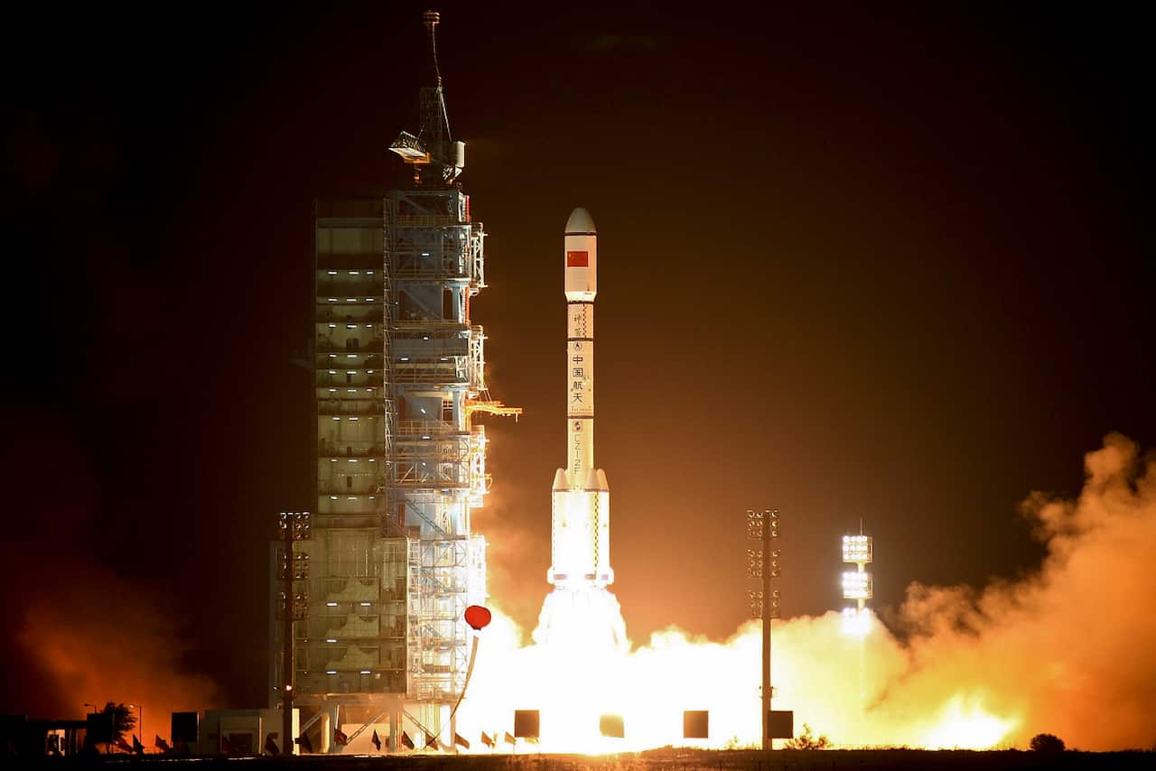 A Long March-2FT1 carrier rocket loaded with China's Tiangong-1 space station blasts off from the launch pad at the Jiuquan Satellite Launch Center in 2011. 