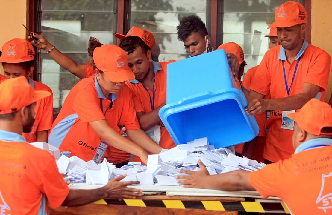 Timor Leste workers count votes during the parliamentary election in Dili.