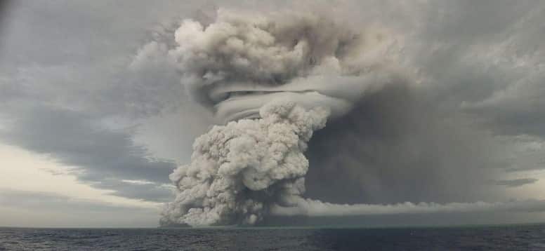 Smoke pours from the volcano on 14 January, one day before its violent eruption.