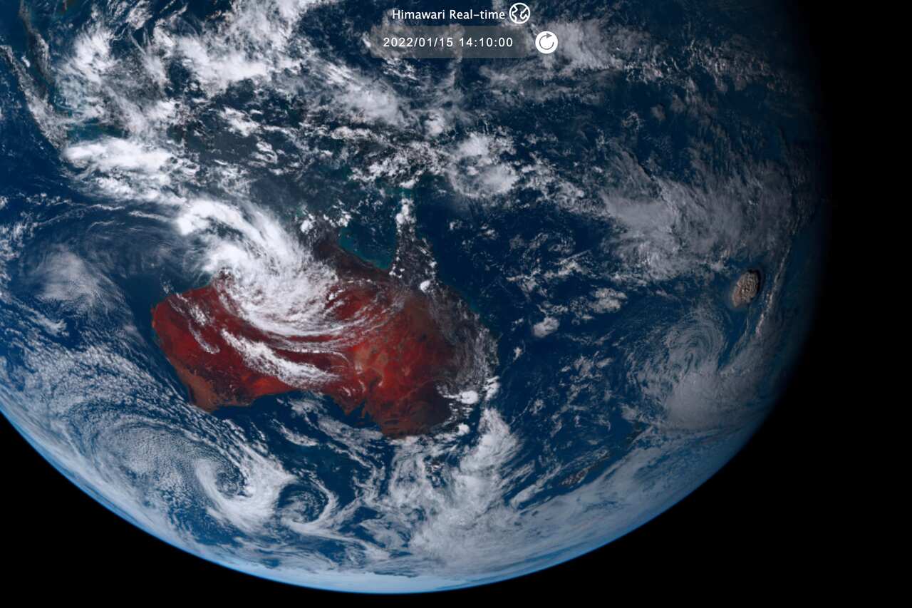 A satellite image taken by Himawari-8, a Japanese weather satellite shows an undersea volcano eruption, right, at Tonga Saturday, 15 January, 2021.