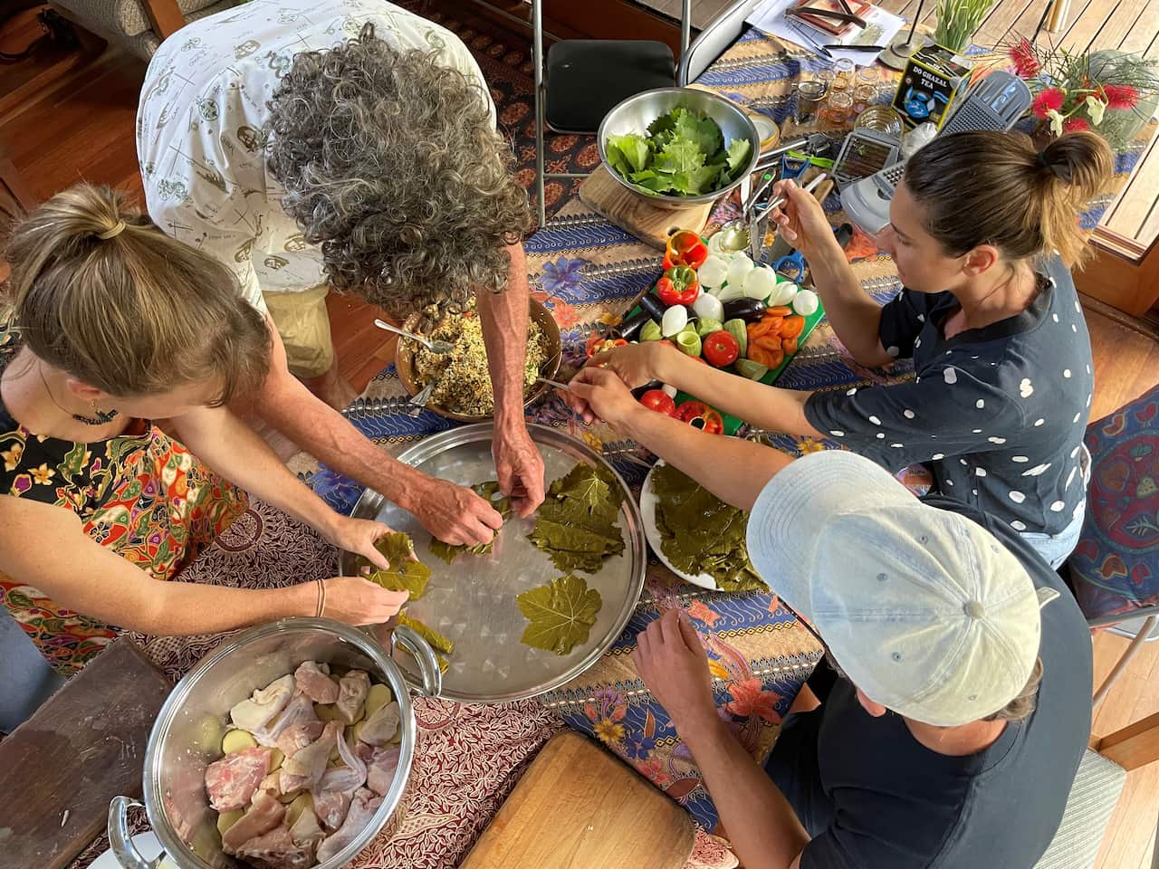 Clients learnt to wrap rice in vine leaves to make Dolma.