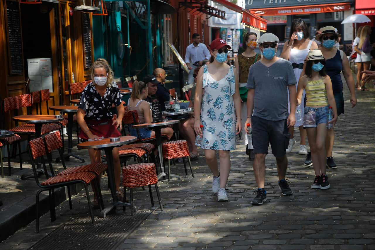 Tourists stroll the Montmartre district in Paris