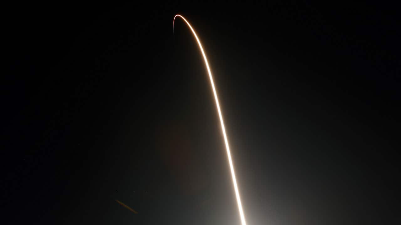 A SpaceX Falcon 9 rocket with a demo Crew Dragon spacecraft on an uncrewed test flight to the International Space Station lifts off.