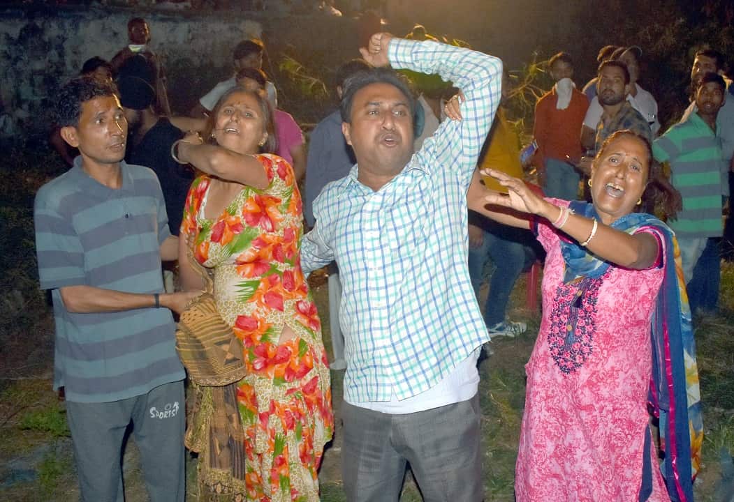 People mourn their relatives after the train accident.