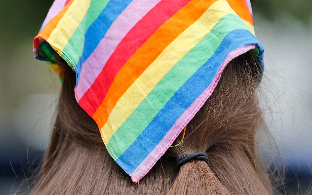 Democratic nominee for the House of Delegates 13th district seat, Danica Roem, wears a rainbow scarf as she greets voters in June 2017.