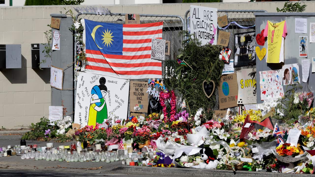 Tributes hang on the fence outside the Al Noor mosque in Christchurch, New Zealand.