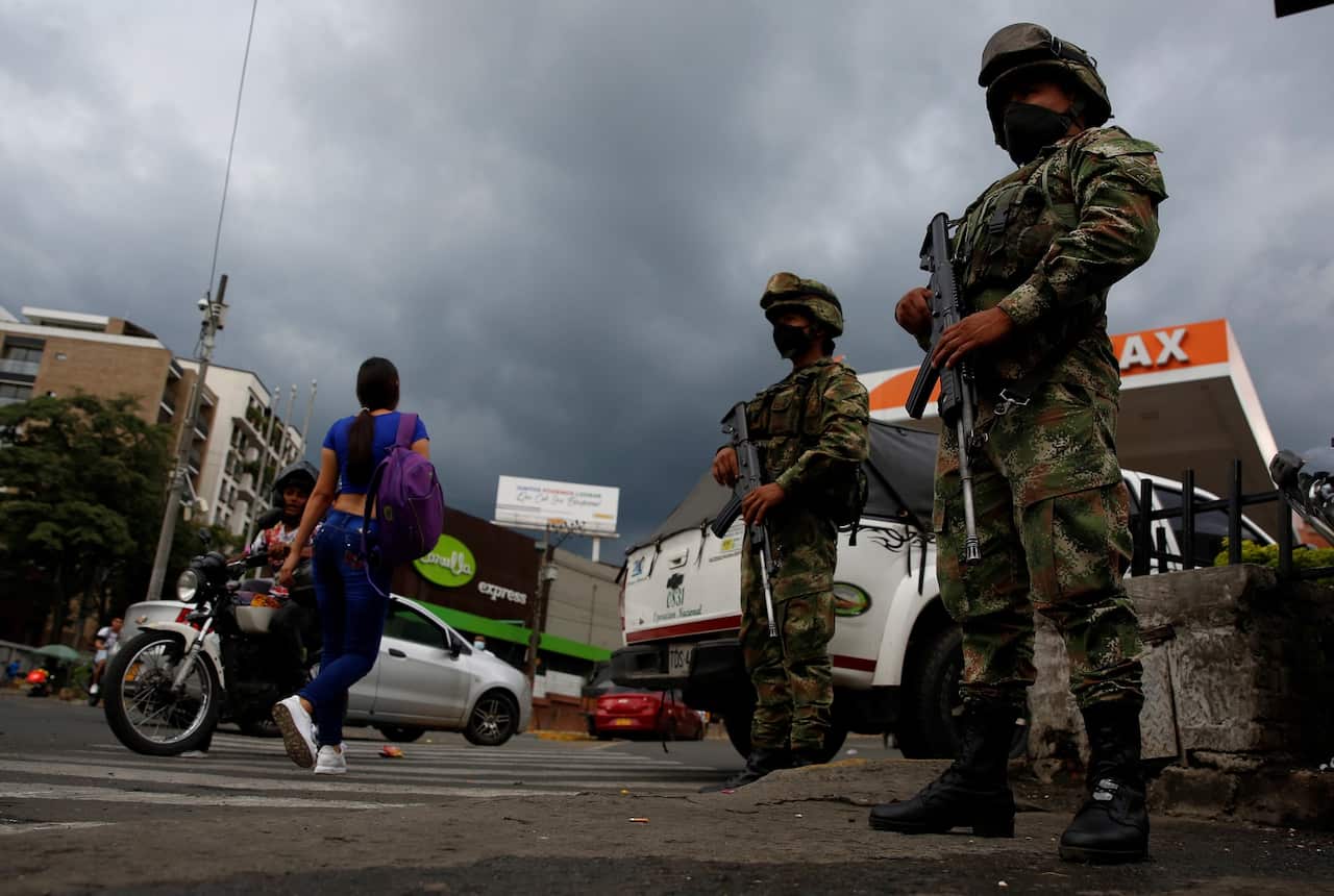 Soldiers guard the streets after Colombian President Ivan Duque ordered a stronger military presence to patrol the streets. 