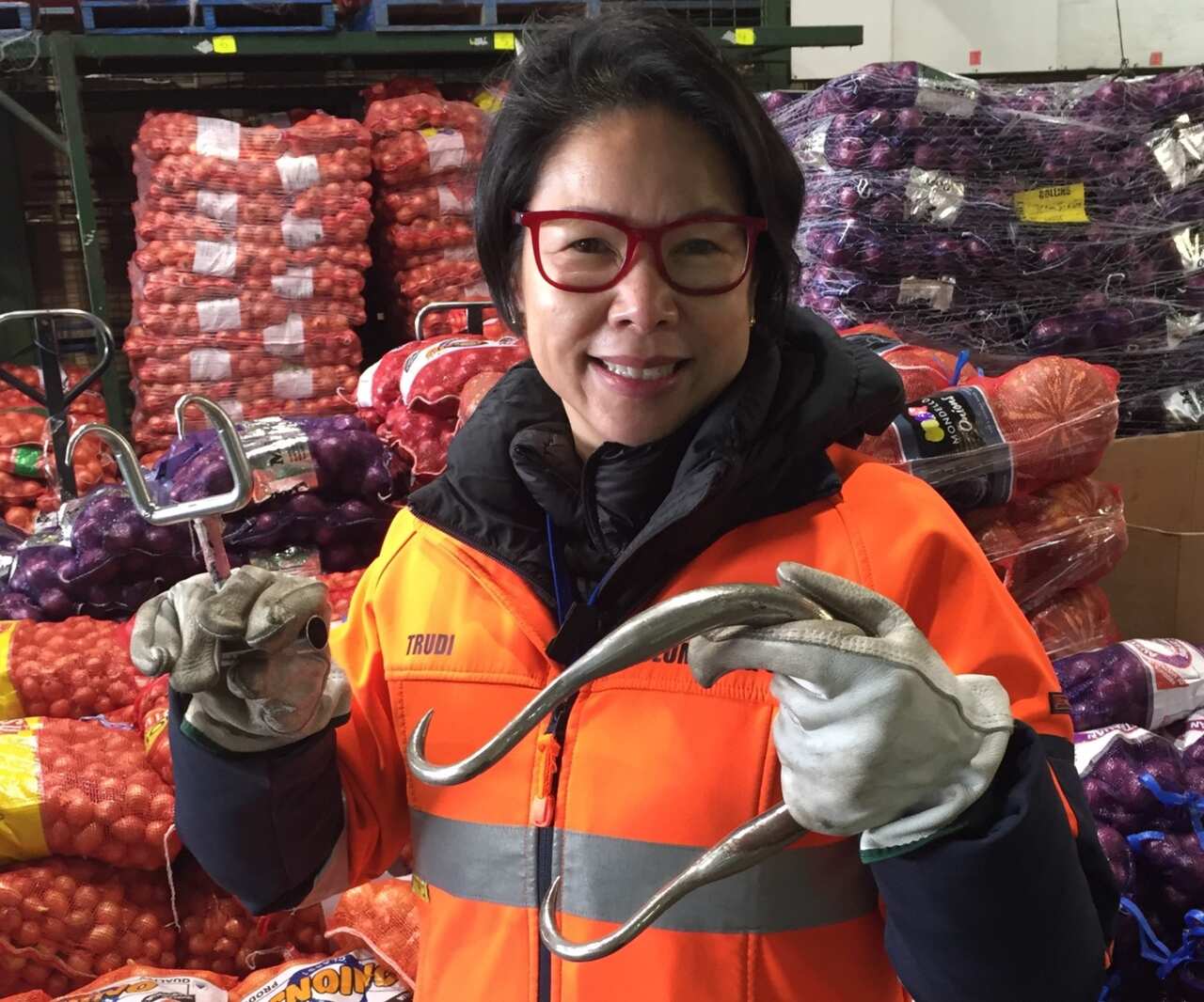 Trudi Yip holding traditional steel bag hooks.